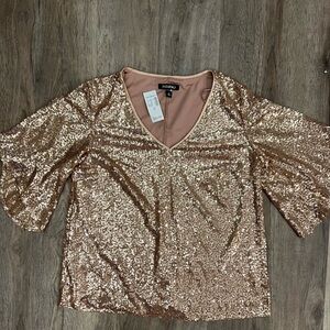 Champagne colored sequin top. NWT